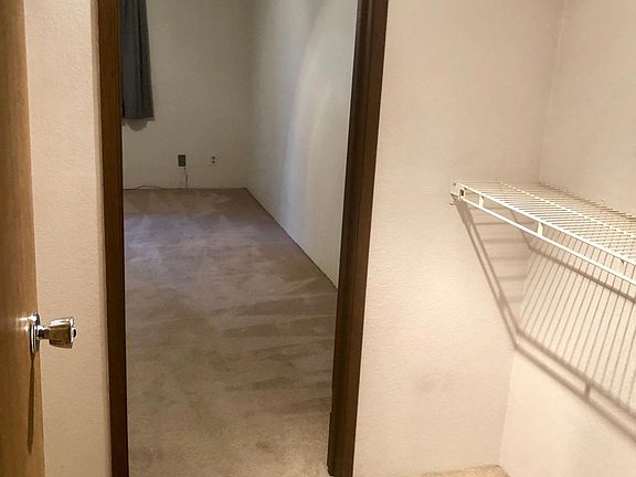 walk in closet connecting master bedroom to bathroom
