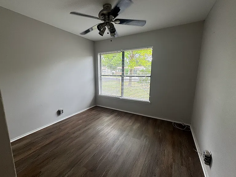 Bedrooms receive lots of natural light. This bedroom also has new flooring.