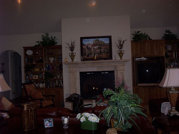 oak cabinetry, travertine fireplace