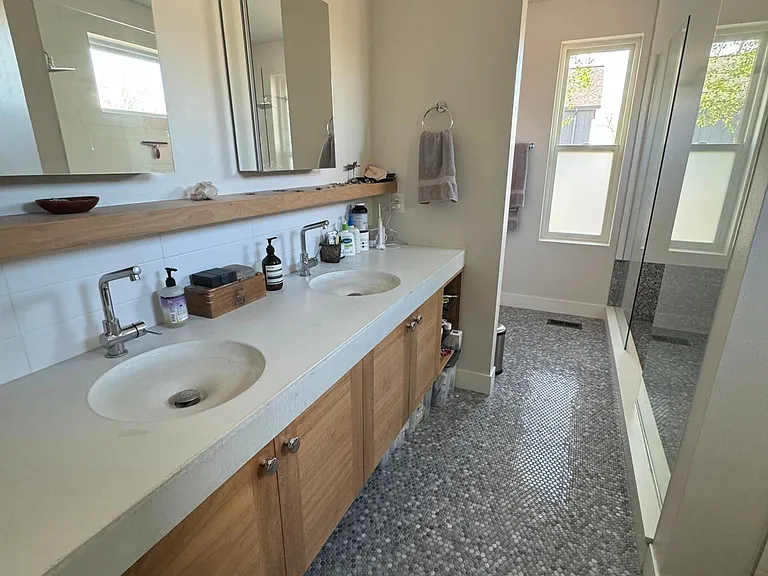 Primary #1 bathroom: double sink, tub, double shower.