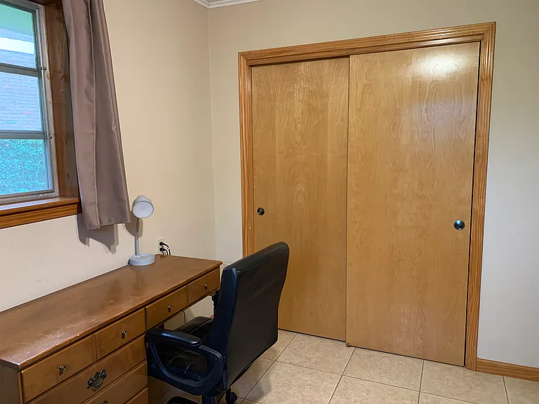Desk and large closet in second bedroom