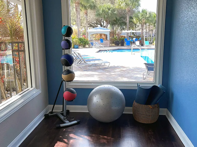 Our Fitness center also offers features a yoga area overlooking the pool.