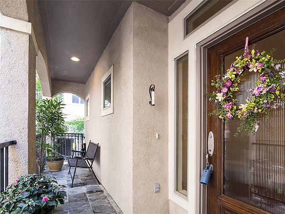 Elevated entrance and side balcony.