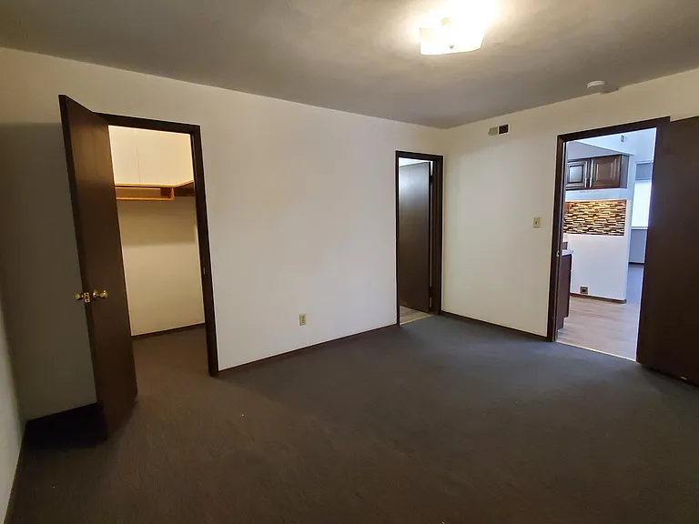 Spacious Master Bedroom with New Comfy Carpet and a Large Walk-In Closet