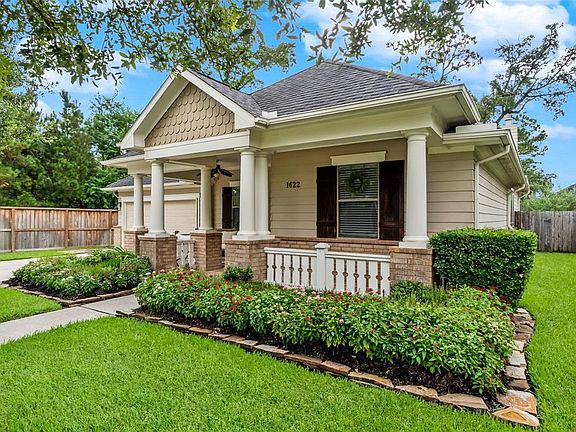 Pretty landscaping and a lush lawn offers great curb appeal.