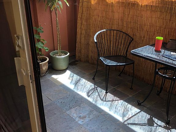 Large Patio Terrace facing south which provides great natural light through the large glass slider into the living room