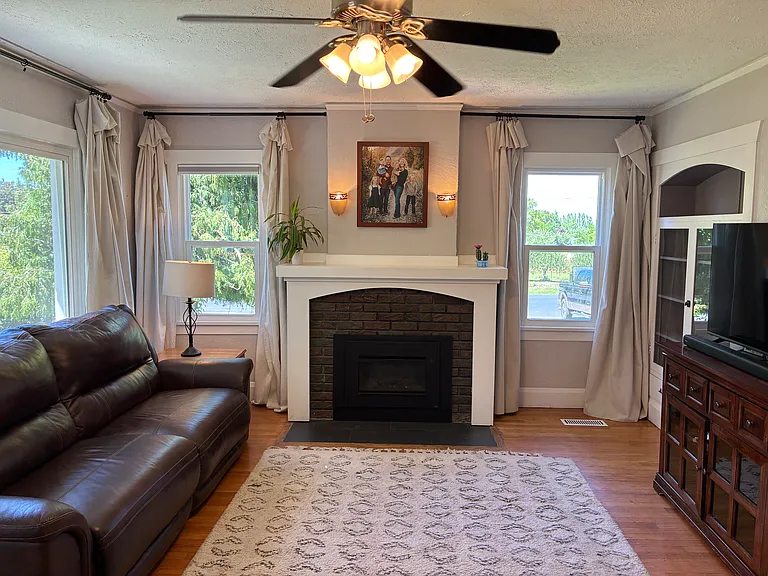 Living room with remote controlled gas insert.
