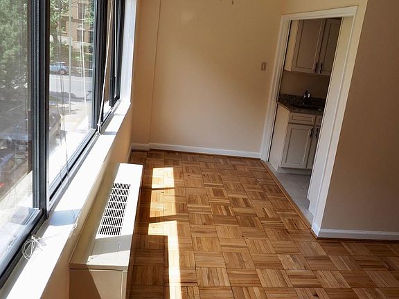 Table sized dining nook with views of trees and Connecticut Avenue