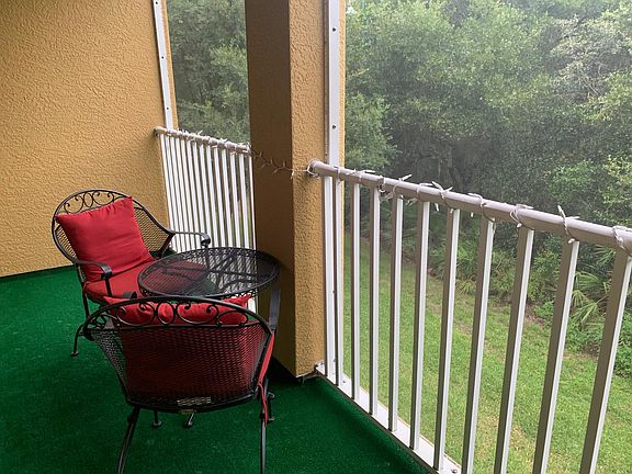 Screened-In Balcony off of Family Room - Nestled against serene woodlands, this space offers ultimate privacy and a tranquil retreat.