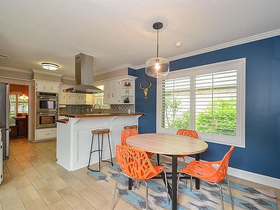 Sophisticated and practical! The kitchen is flanked by a formal dining room and breakfast room.