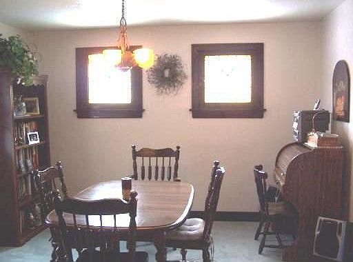Dining Room: CHARMING DINING AREA WITH STAINE GLASS WINDOWS