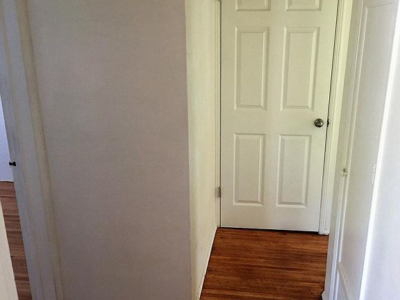 Hallway with full closet plus utility storage