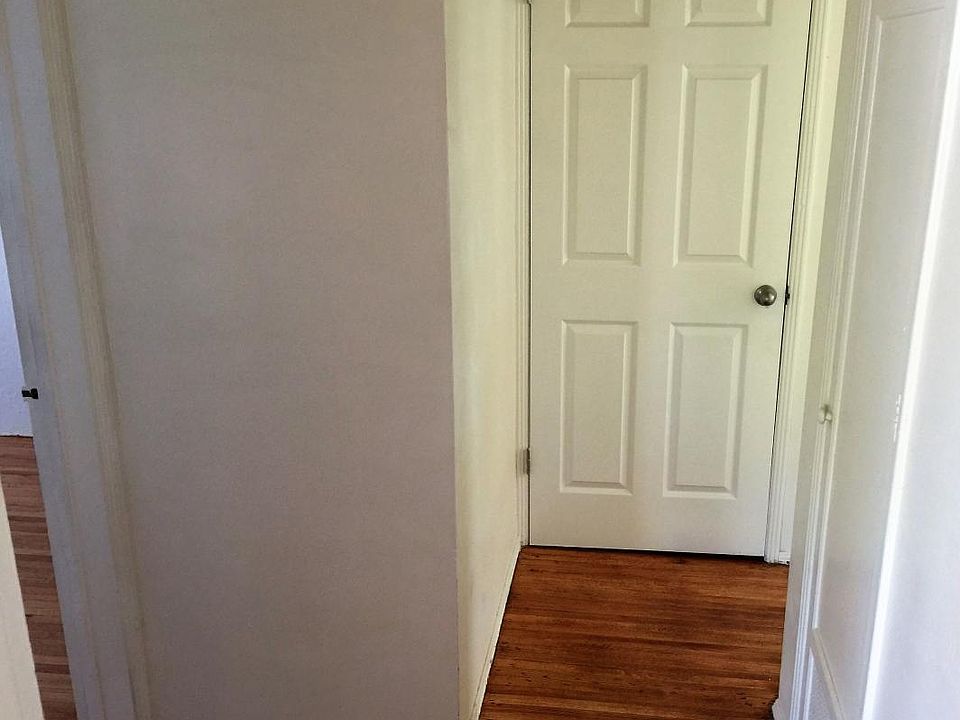 Hallway with full closet plus utility storage