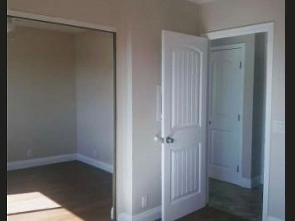 Bedroom #2 with mirrored closet.