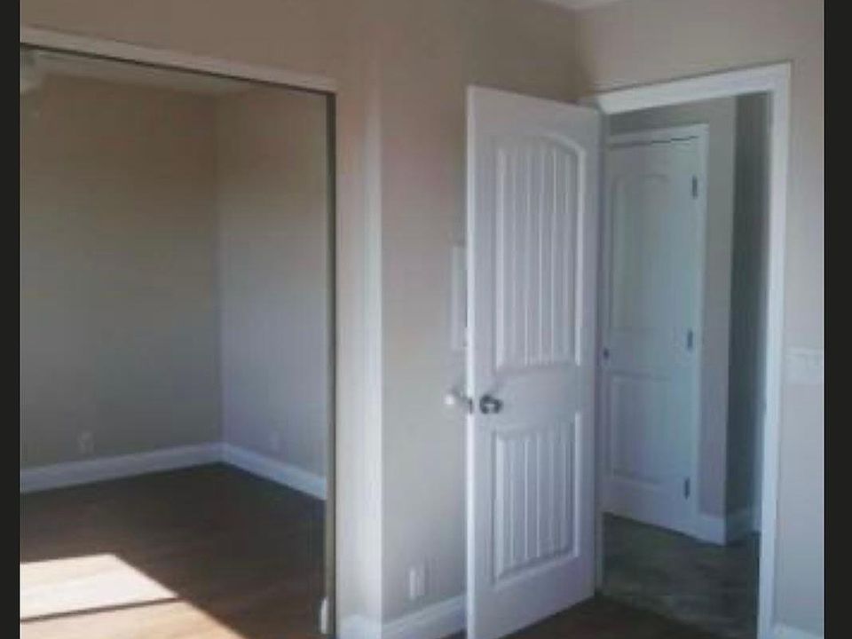 Bedroom #2 with mirrored closet.