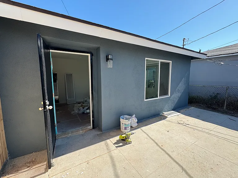Front door to house. Work was still being done when photo was taken.