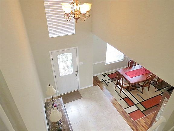 Double story, raised foyer greets guests.