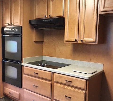 Chefs itchen with Corian counters and upgraded cabinets and appliances