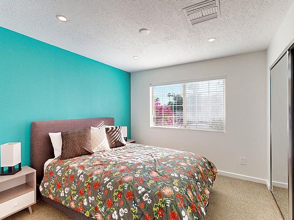 Bedroom #1 has a full size bed and two night stands in it.
