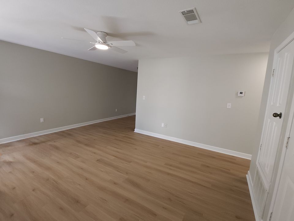 LARGE OPEN LIVING ROOM WITH LUXURY VINYL PLANK THROUGHOUT