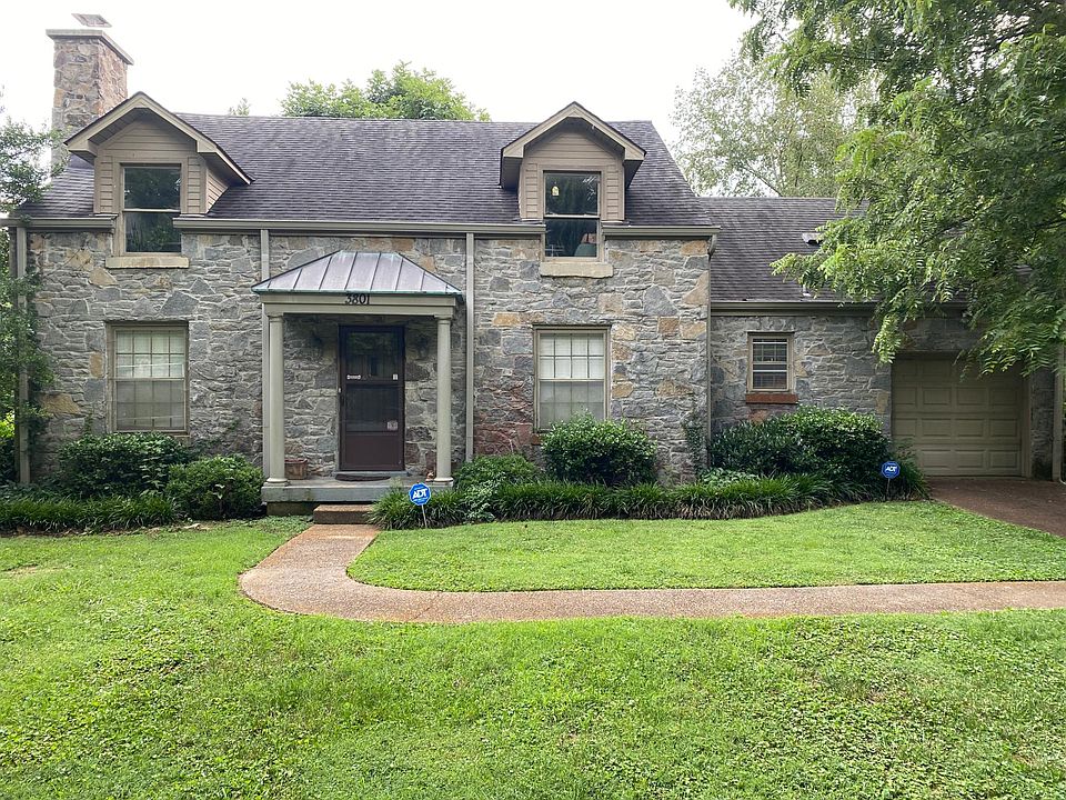 Front of house and entrance to apartment