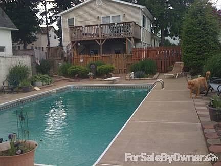 Pool view
						:
						2nd floor garage deck overlooks pool.
New liner (2013) and new pump (2012)