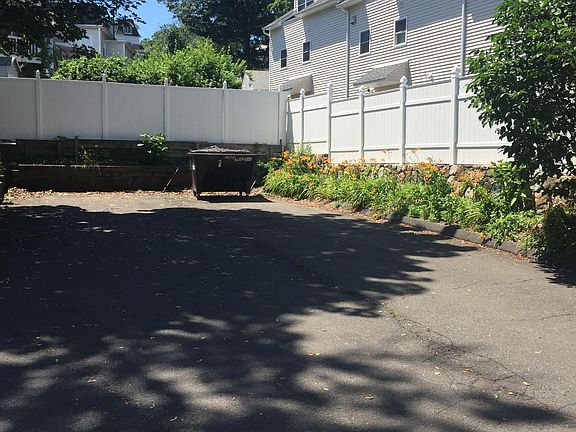 View of private parking area in rear of building.