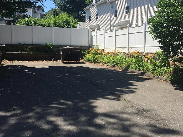 View of private parking area in rear of building.