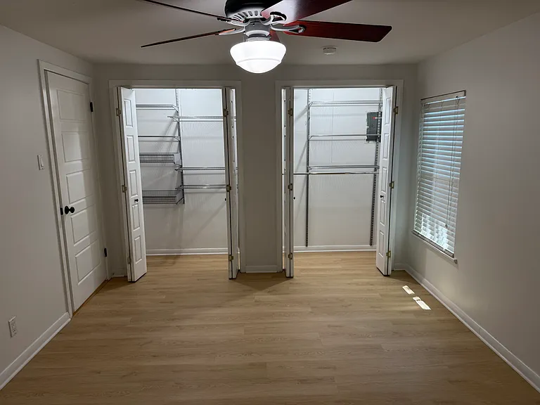 primary bedroom with closet organization system