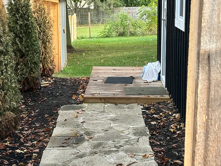 Walk way to entry and back yard w/deck