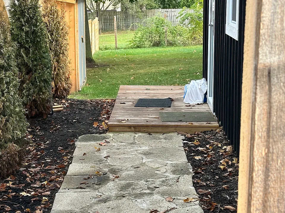 Walk way to entry and back yard w/deck