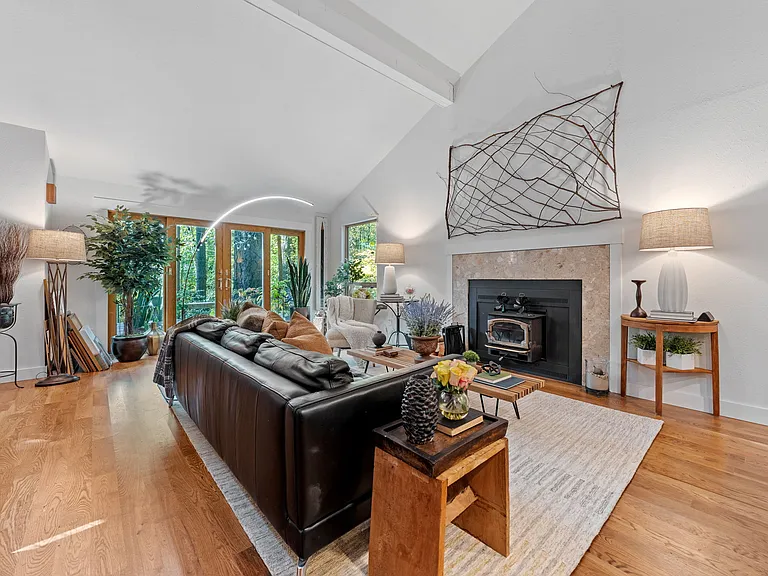 View of living room and french doors leading to front deck