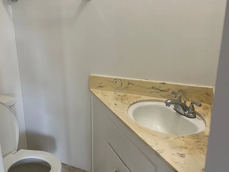 half bathroom off living room/kitchen