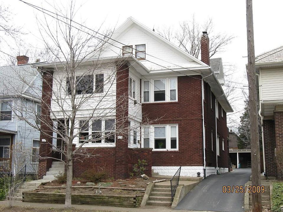Upper three bedroom apartment with enclosed front porch and open rear porch