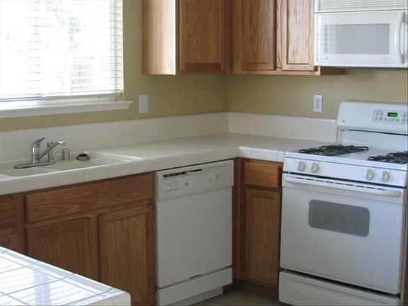 Gas range, dishwasher and microwave and nice pantry closet
