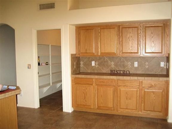 So many great cabinets and additional counterspace. Look at the HUGE WALK-IN pantry! Chef's delight kitchen lets you cook and entertain at the same time!
