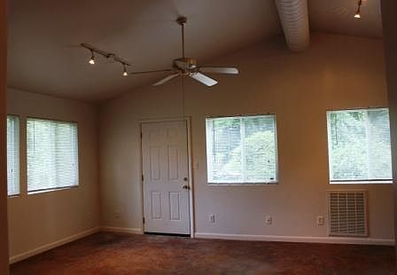 vaulted ceilings and concrete floors