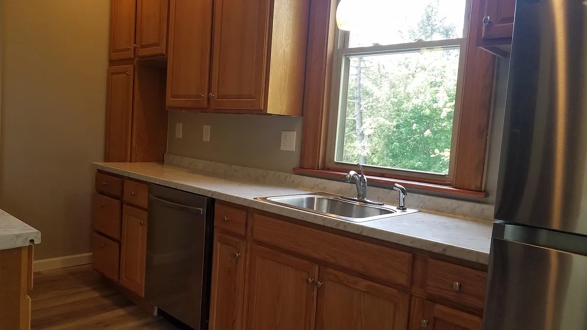 Kitchen has stainless steel appliances, including gas stove, refrigerator and dishwasher. - 1025 Forest Ave #2