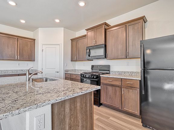 The kitchen comes with a full suite of energy-efficient appliances