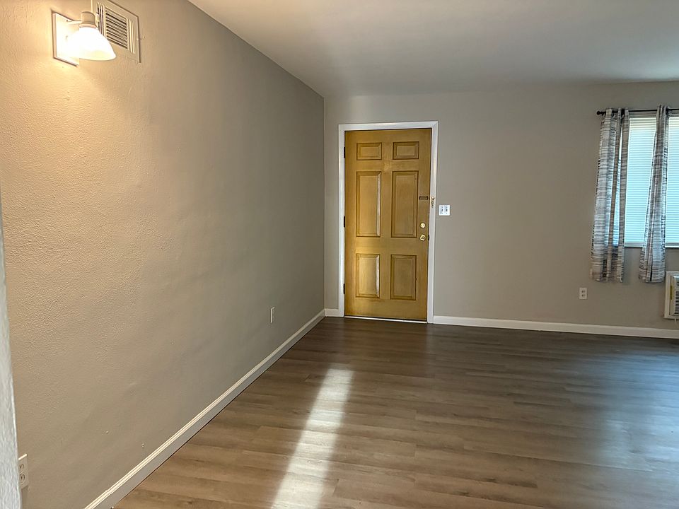 View of living room showing entrance door