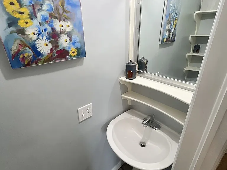 small lavatory in main rental bedroom (west)