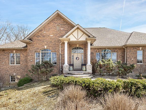 The home is located on a 3 acre wooded lot with a potential additional land. The front retaining wal