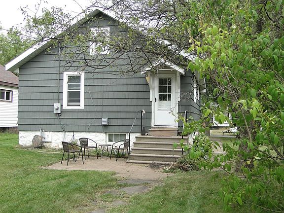 Back of house w/small patio