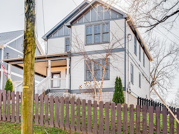 Fenced in front and backyard with covered porch and porch swing!