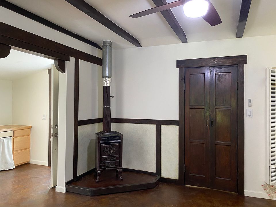 Living room stove and door to bedroom