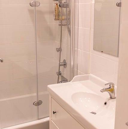 Large tub, glass & shower with multiple massage heads, rain shower and hand held