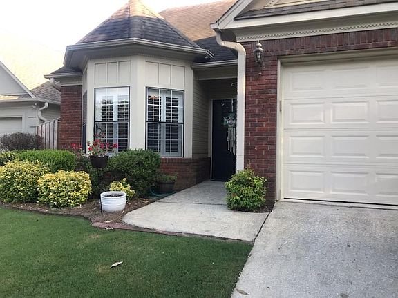 Front door entrance and 2 car garage at ground level