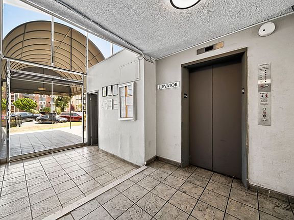 Welcoming entry area featuring elevator access for added convenience.
