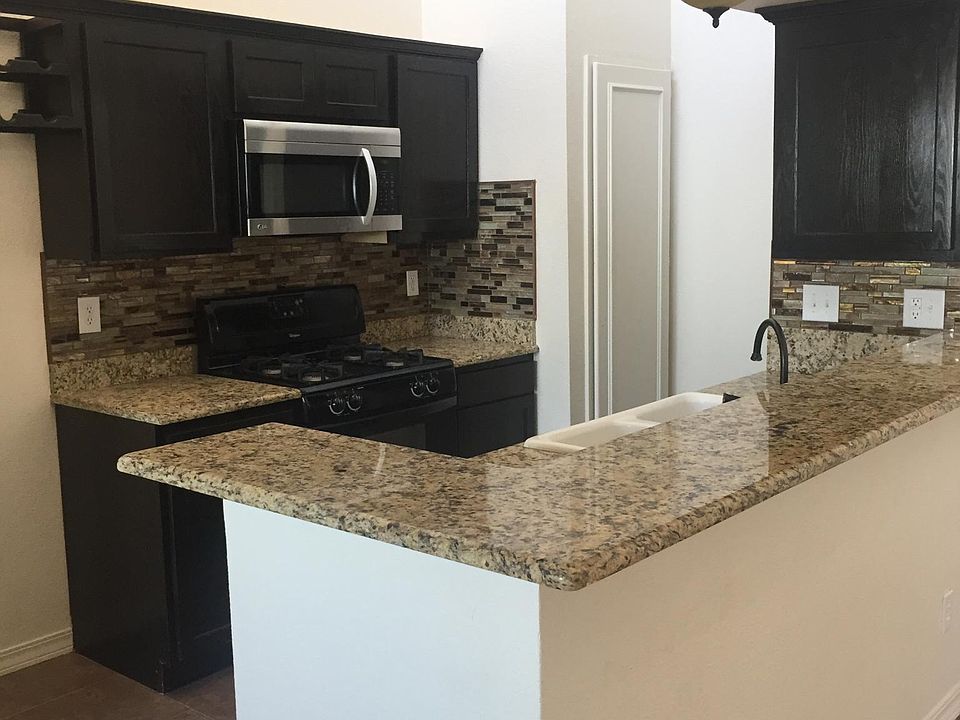open design, all granite in unit. Microwave, stove, dishwasher, disposal.