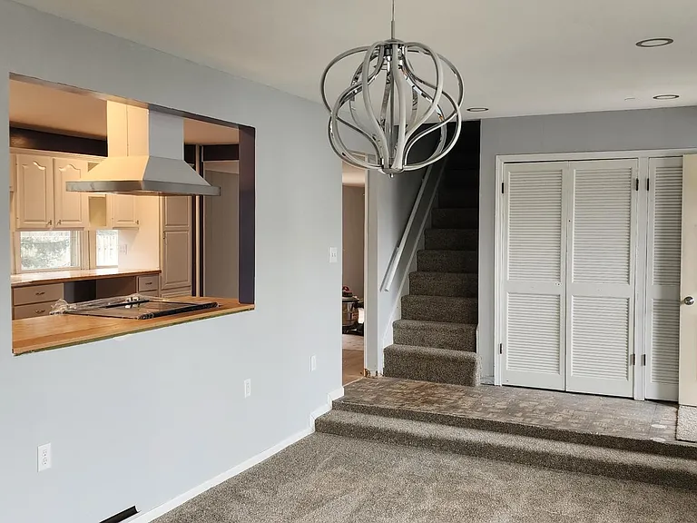 I love that lamp in the living room. kitchen to your left. at the end is an 8x8 large closet. Main entrance